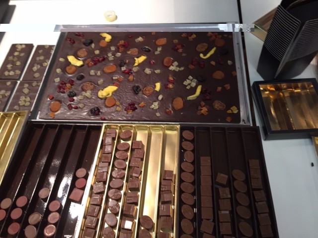 Slabs of chocolate with a variety of candied fruit and nuts
